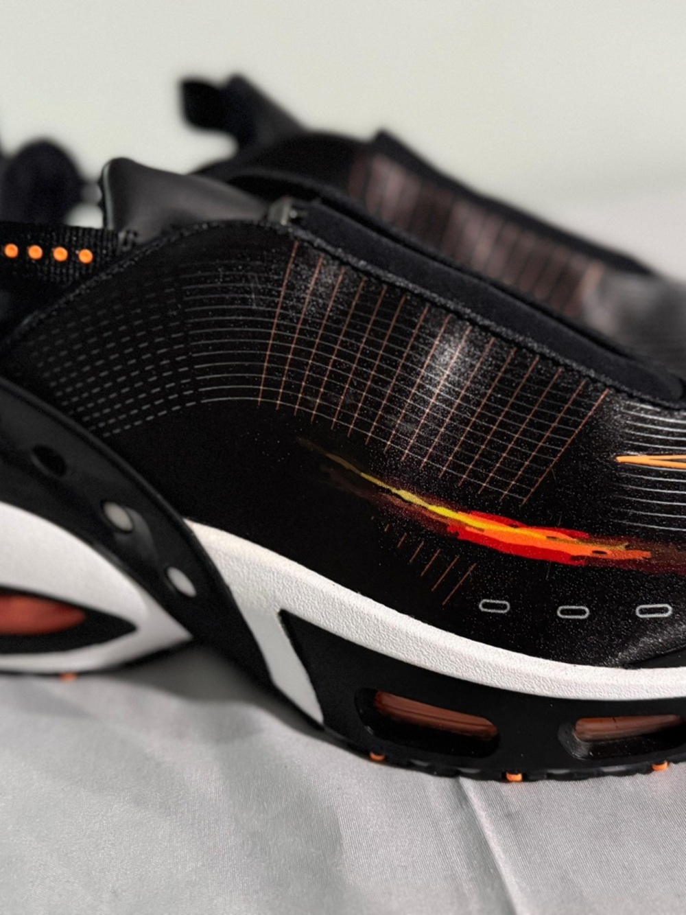 Nike Black Sneakers with Orange and Red Accent